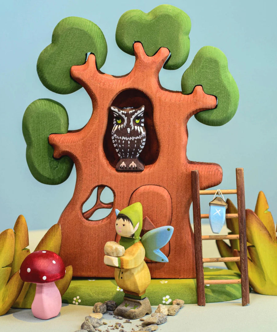 A Bumbu Wooden Winged Elf in a small world play scene. The Bumbu ancient oak tree with owl can be seen in the background.