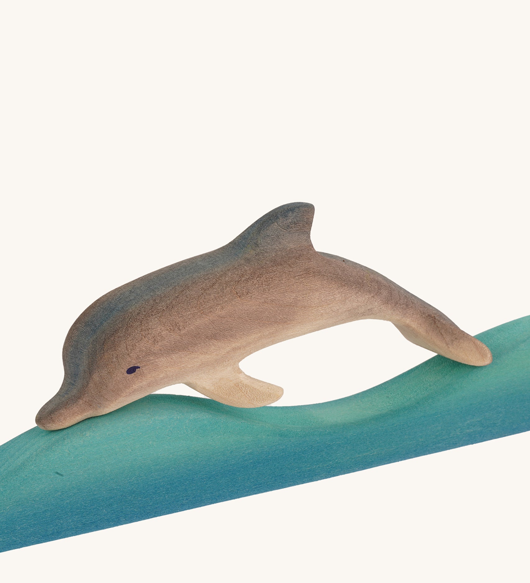 Bumbu Wooden Dolphin figure on a plain background.