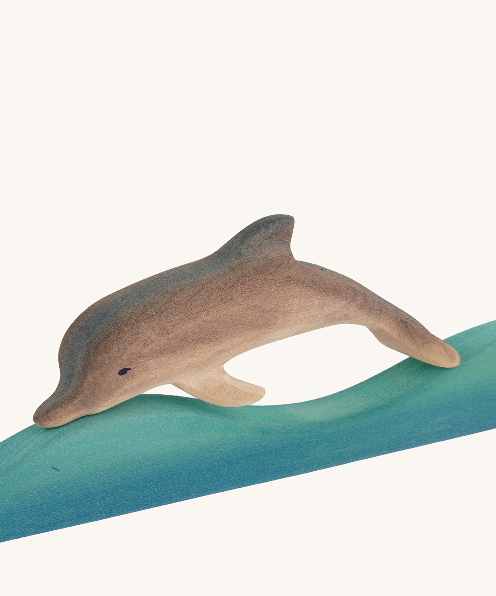 Bumbu Wooden Dolphin figure on a plain background.