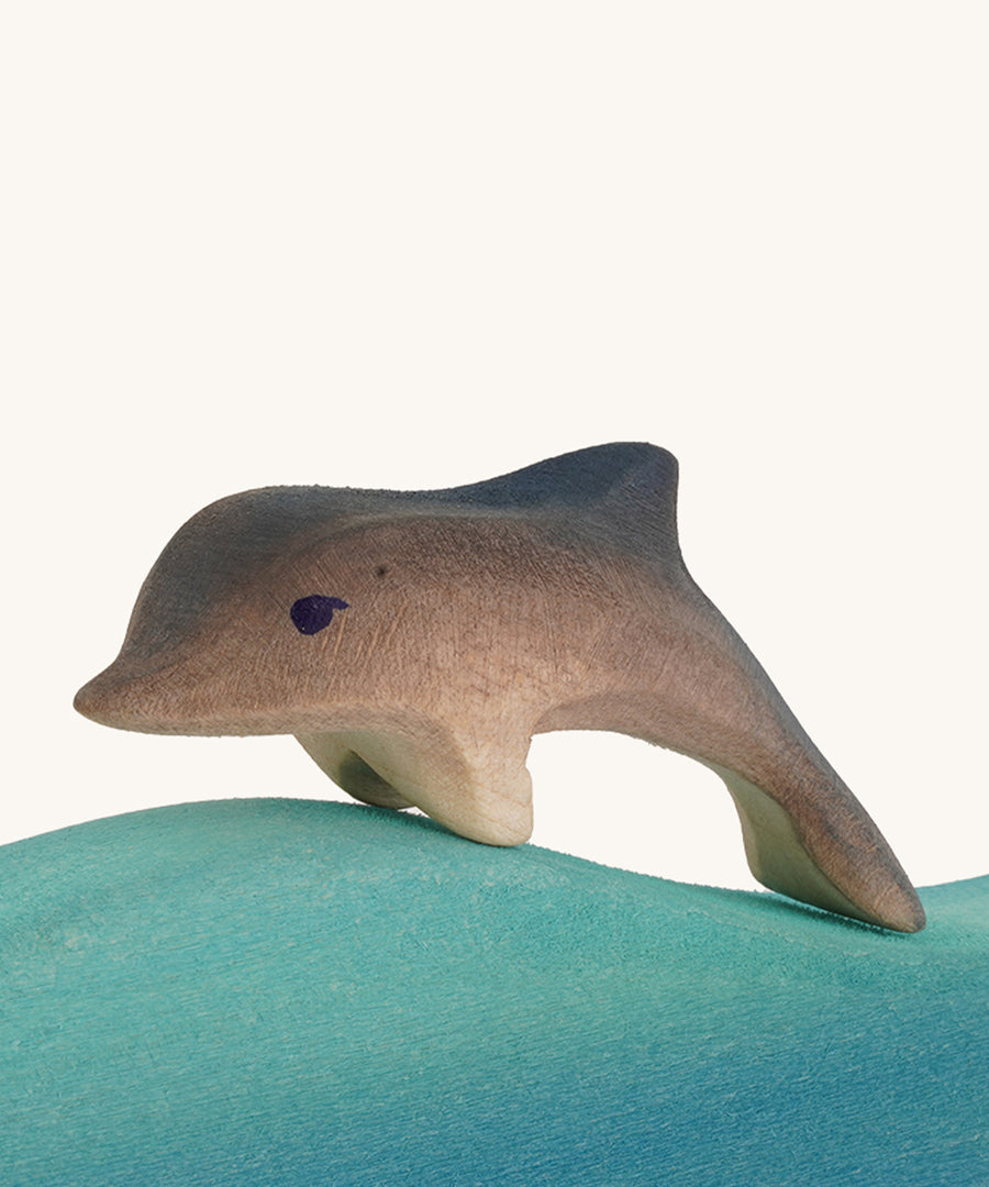 Bumbu wooden baby dolphin figure.