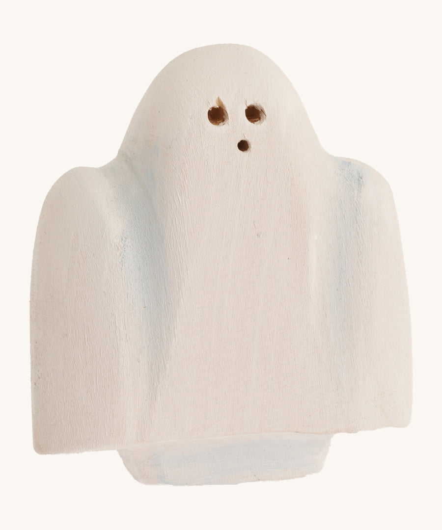 Bumbu wooden ghost figure on a plain background.