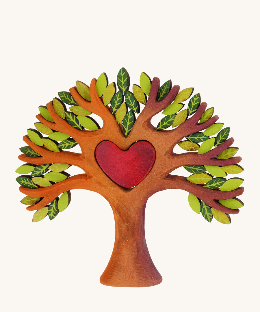 Bumbu wooden heart tree on a plain background.