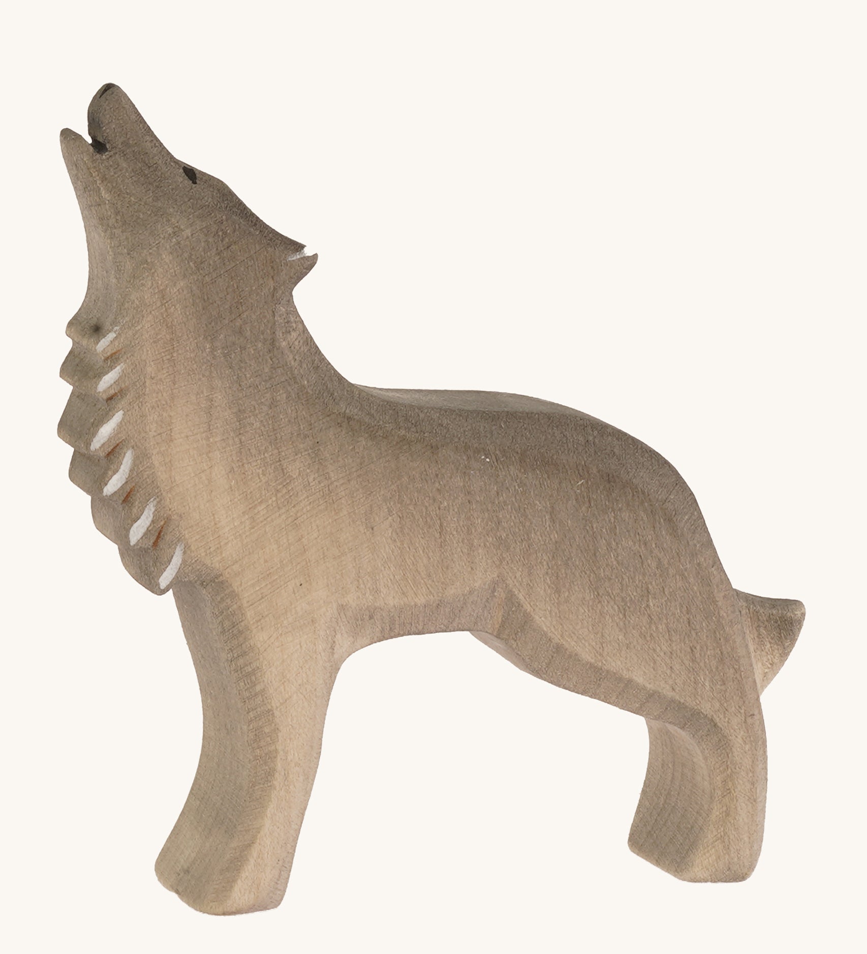 Bumbu wooden howling wolf figure on a plain background.