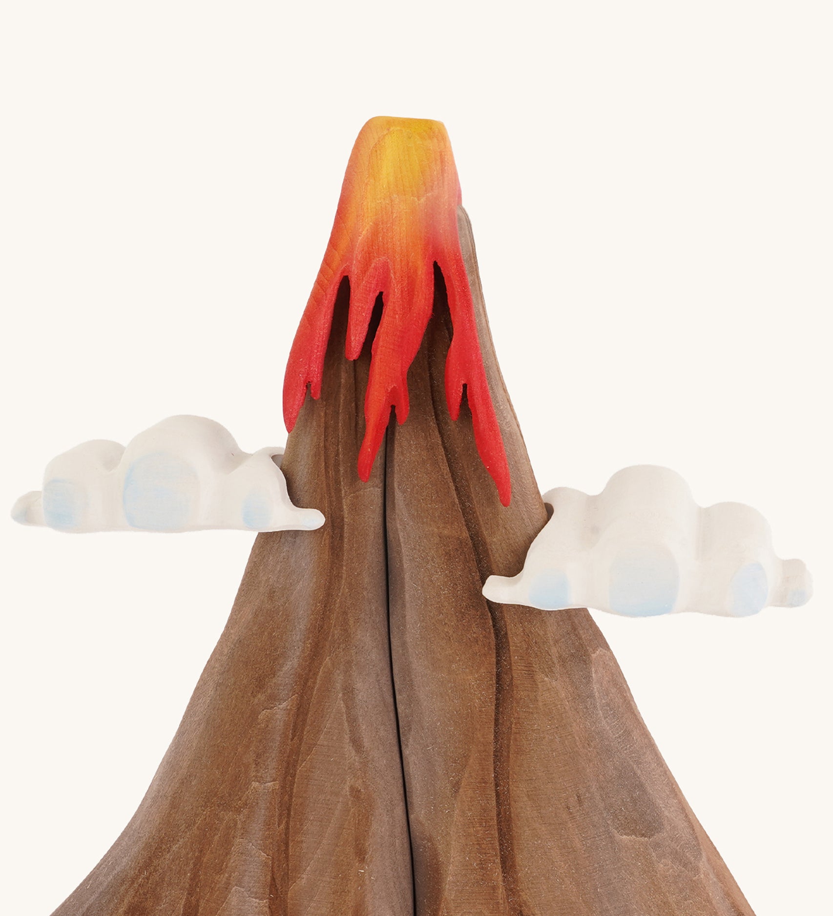 A close up of the A Bumbu volcano wooden toy on a plain background.