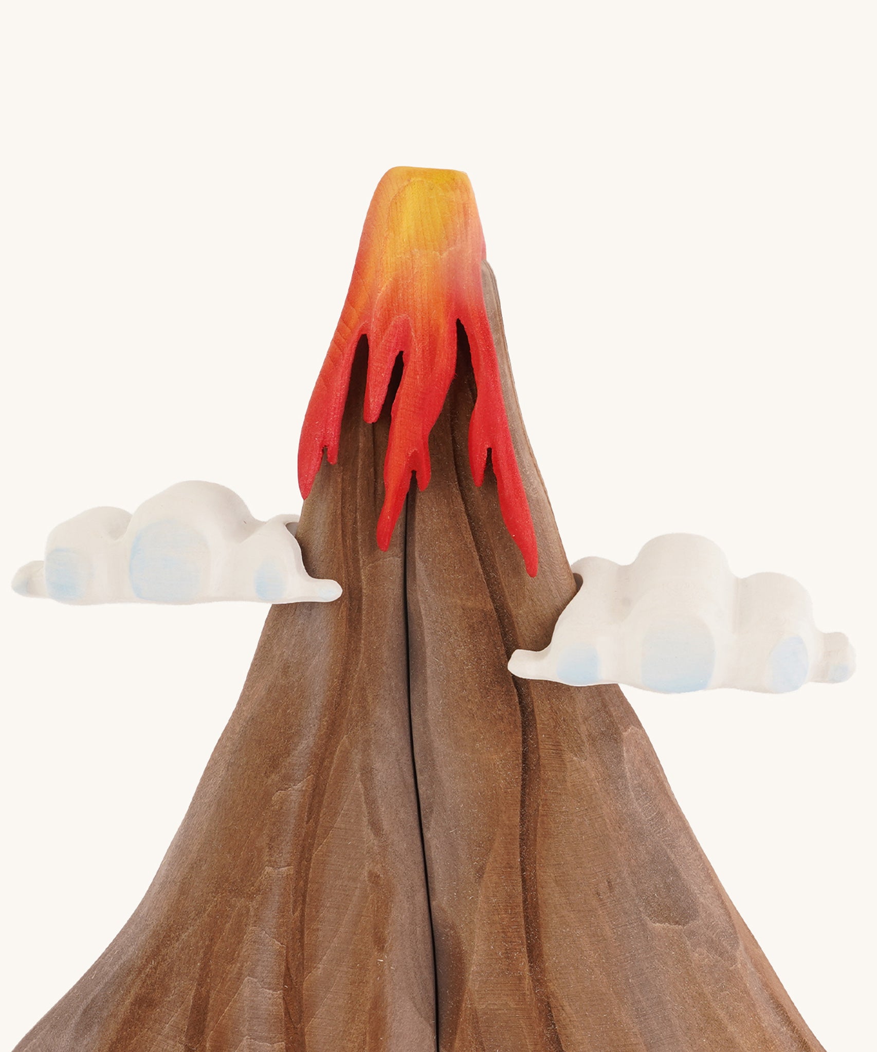 A close up of the A Bumbu volcano wooden toy on a plain background.