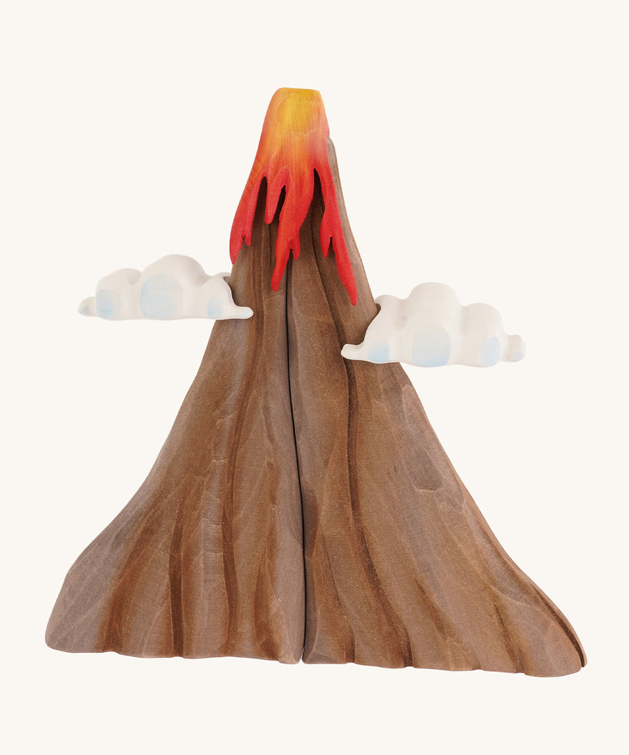 A Bumbu volcano wooden toy on a plain background.