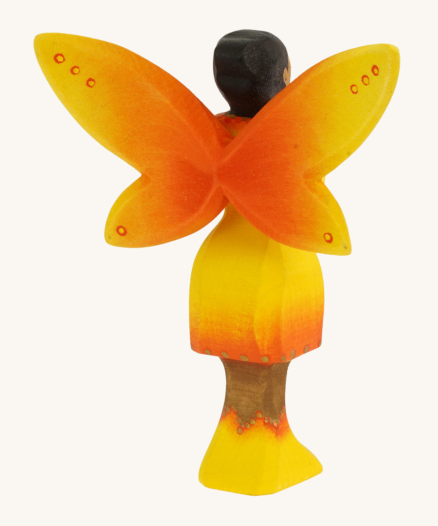 Bumbu Wooden Sunflower Fairy on a plain background showing the back of the figure.