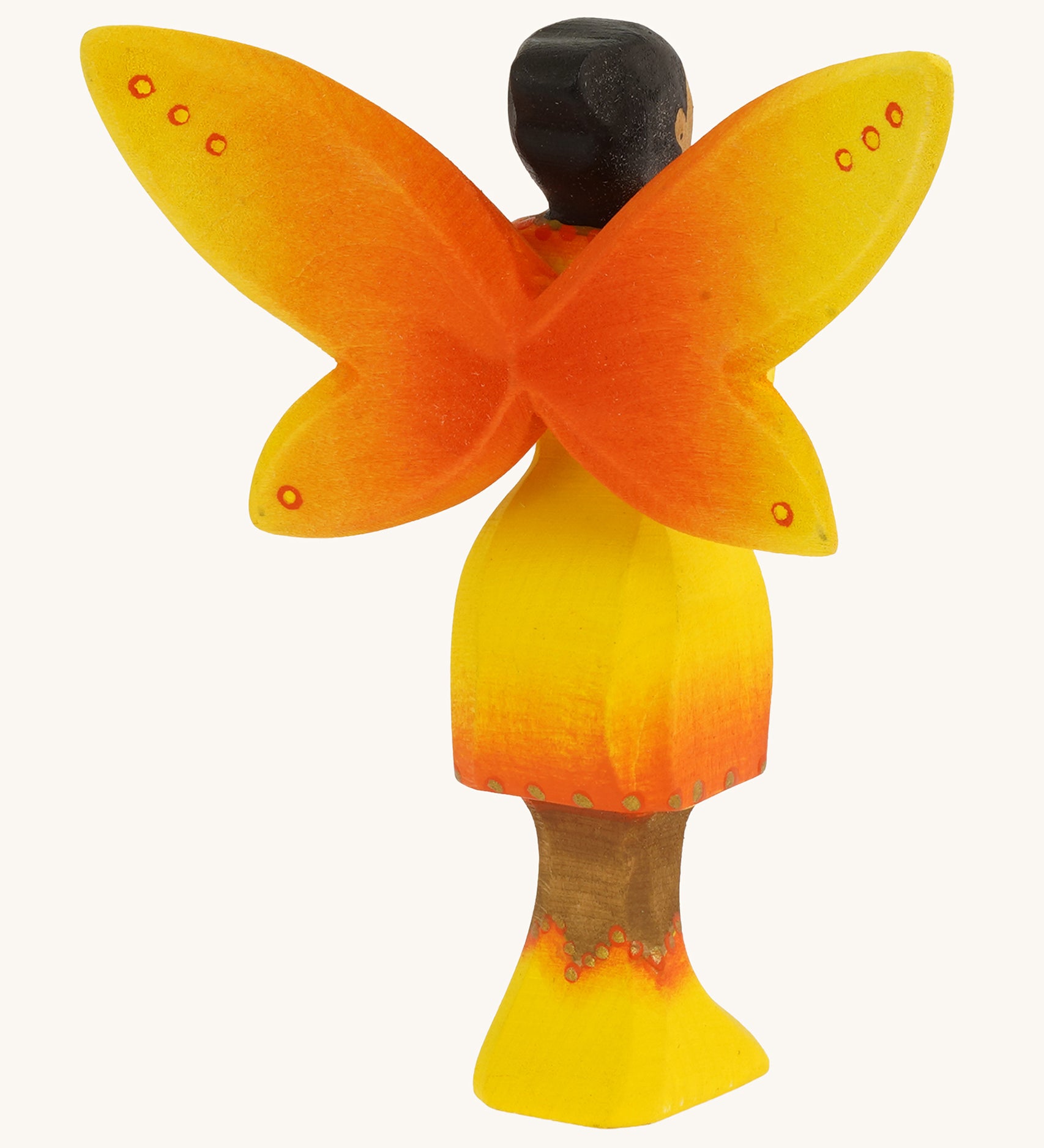 Bumbu Wooden Sunflower Fairy on a plain background showing the back of the figure.