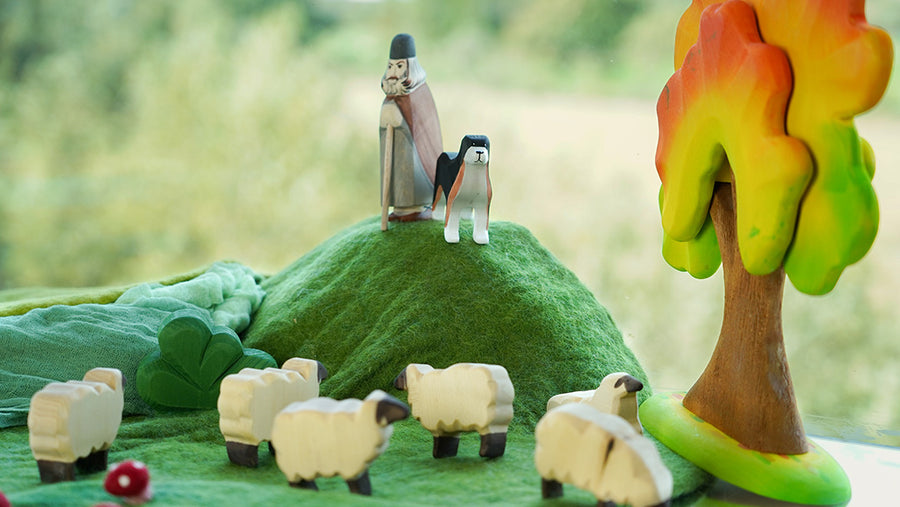 Bumbu wooden toys playscene with a shepherd, sheep dog, and sheep on a mountain