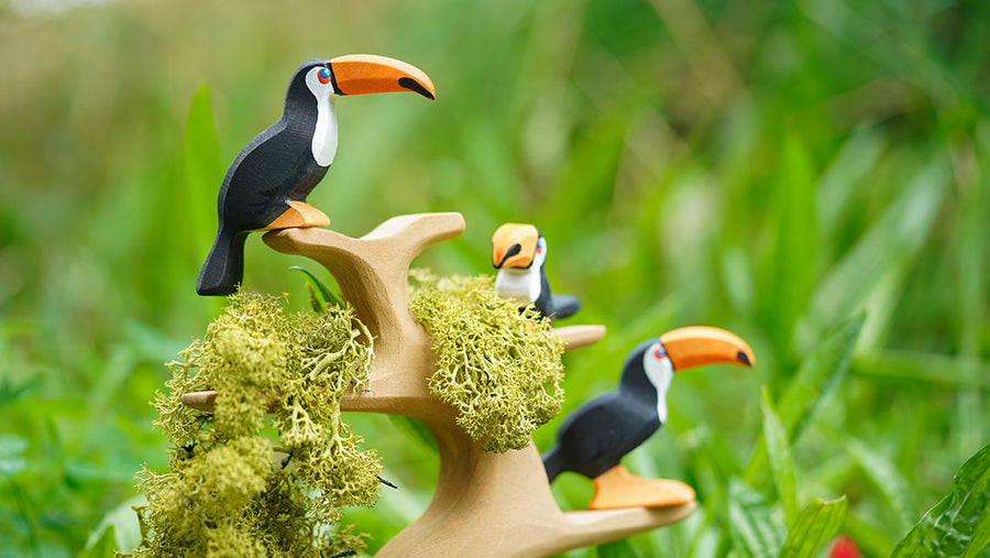 Bumbu wooden toy toucans posed on a Bumbu tree branch