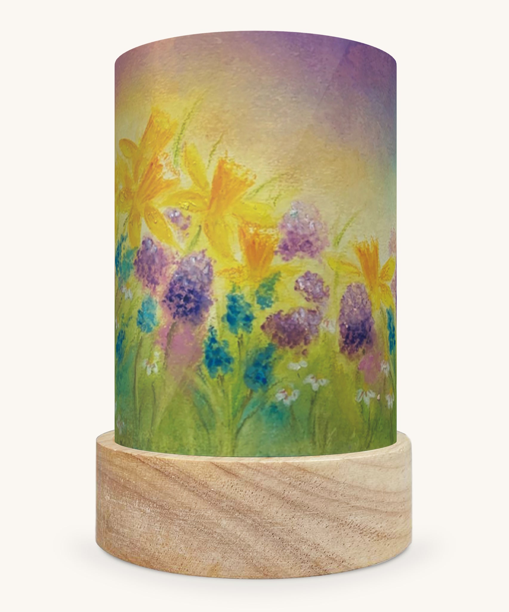 The Burst Of Spring illustration by Baukje Exler sat in a Toverlux Magic Lantern base, on a cream background