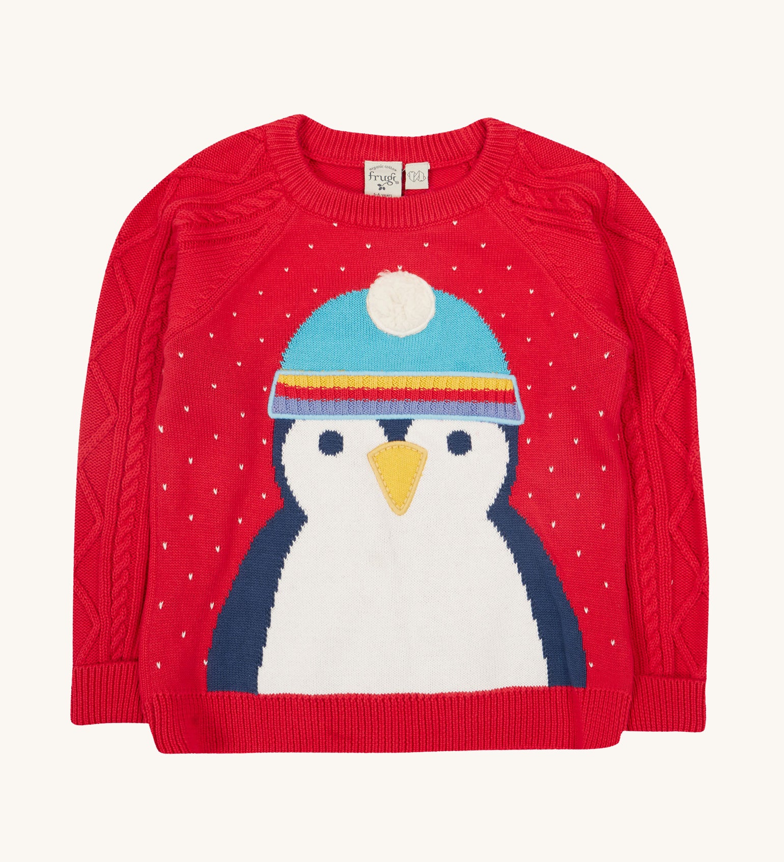 Caleb Character Knit Jumper - True Red/Penguin. Made from 100% soft organic cotton in a Penguin design with embroidery on the front. Featuring cable knit sleeves, this baby and toddler jumper has button fastenings and extra long rib cuffs on the sleeves that unfold