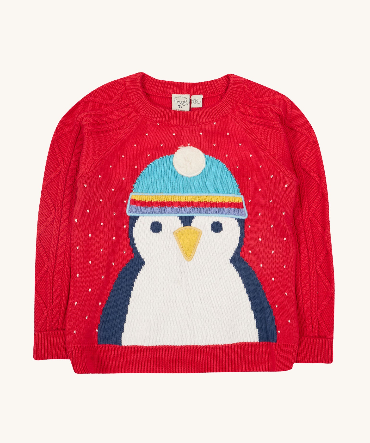 Caleb Character Knit Jumper - True Red/Penguin. Made from 100% soft organic cotton in a Penguin design with embroidery on the front. Featuring cable knit sleeves, this baby and toddler jumper has button fastenings and extra long rib cuffs on the sleeves that unfold