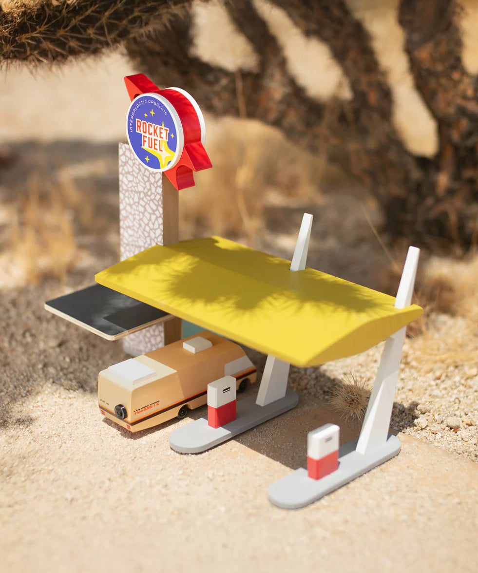 The Candylab Rocket Fuel Station under the shade of a cactus with a desert background