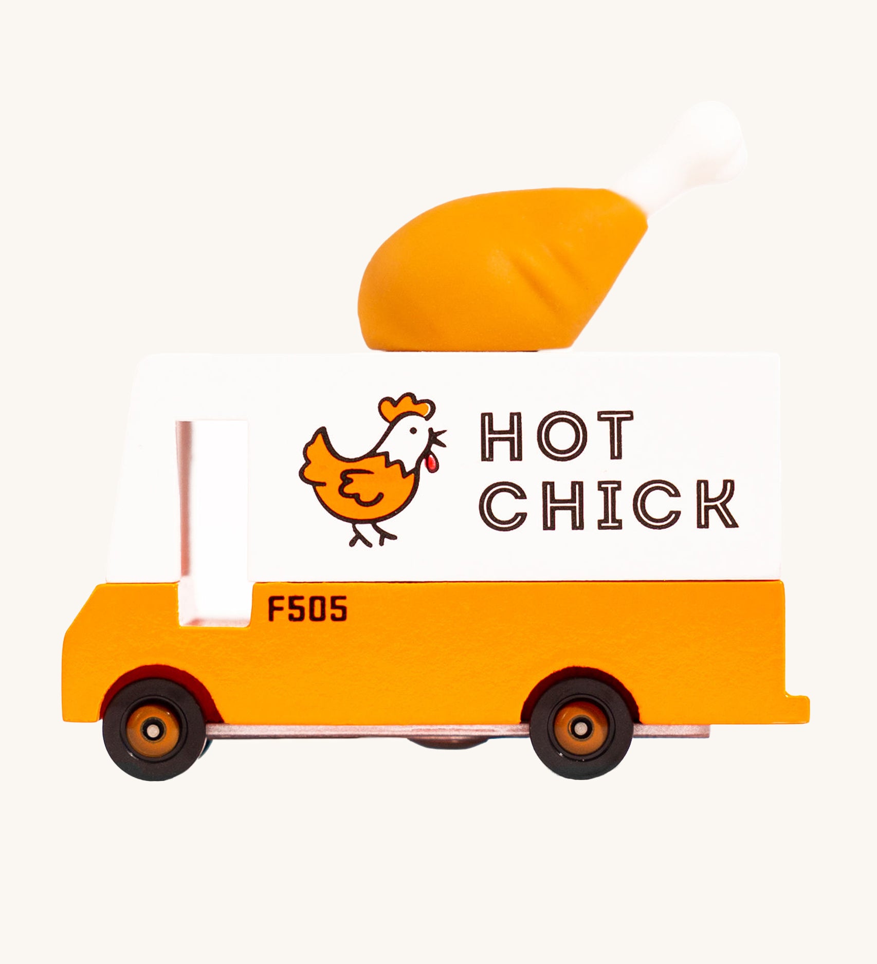 Candylab Candyvan - Fried Chicken Van, is a yellow and white van with a fun, rubber chicken drumstick on the top. The image is on a cream background