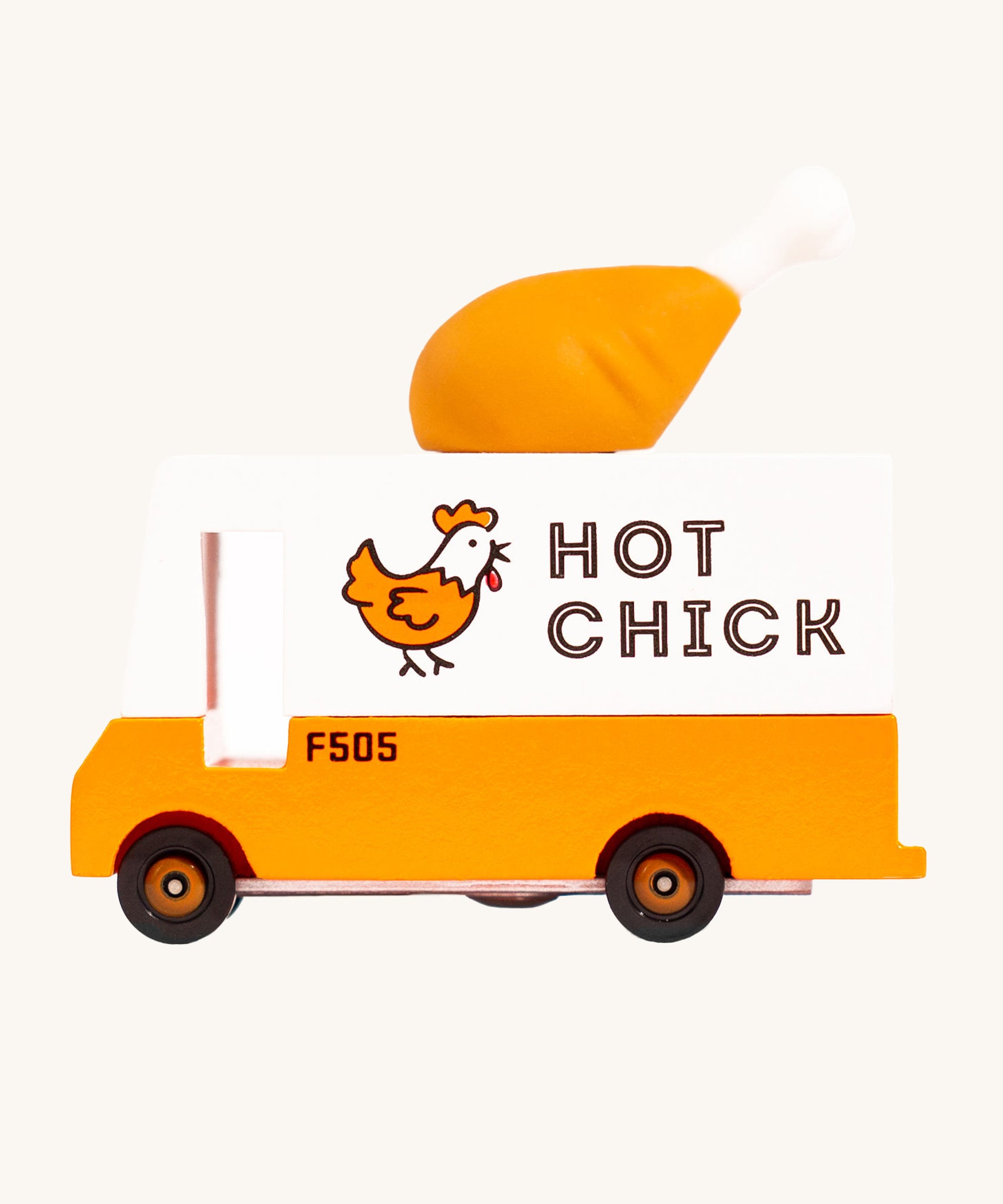 Candylab Candyvan - Fried Chicken Van, is a yellow and white van with a fun, rubber chicken drumstick on the top. The image is on a cream background