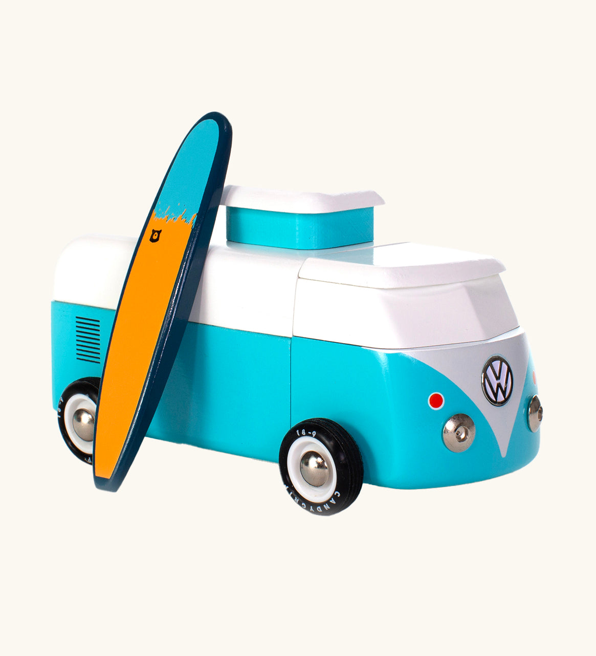 The Candylab VW Beach bus in blue, with a wooden blue and yellow surf board propped up next to the van, The image is on a cream background