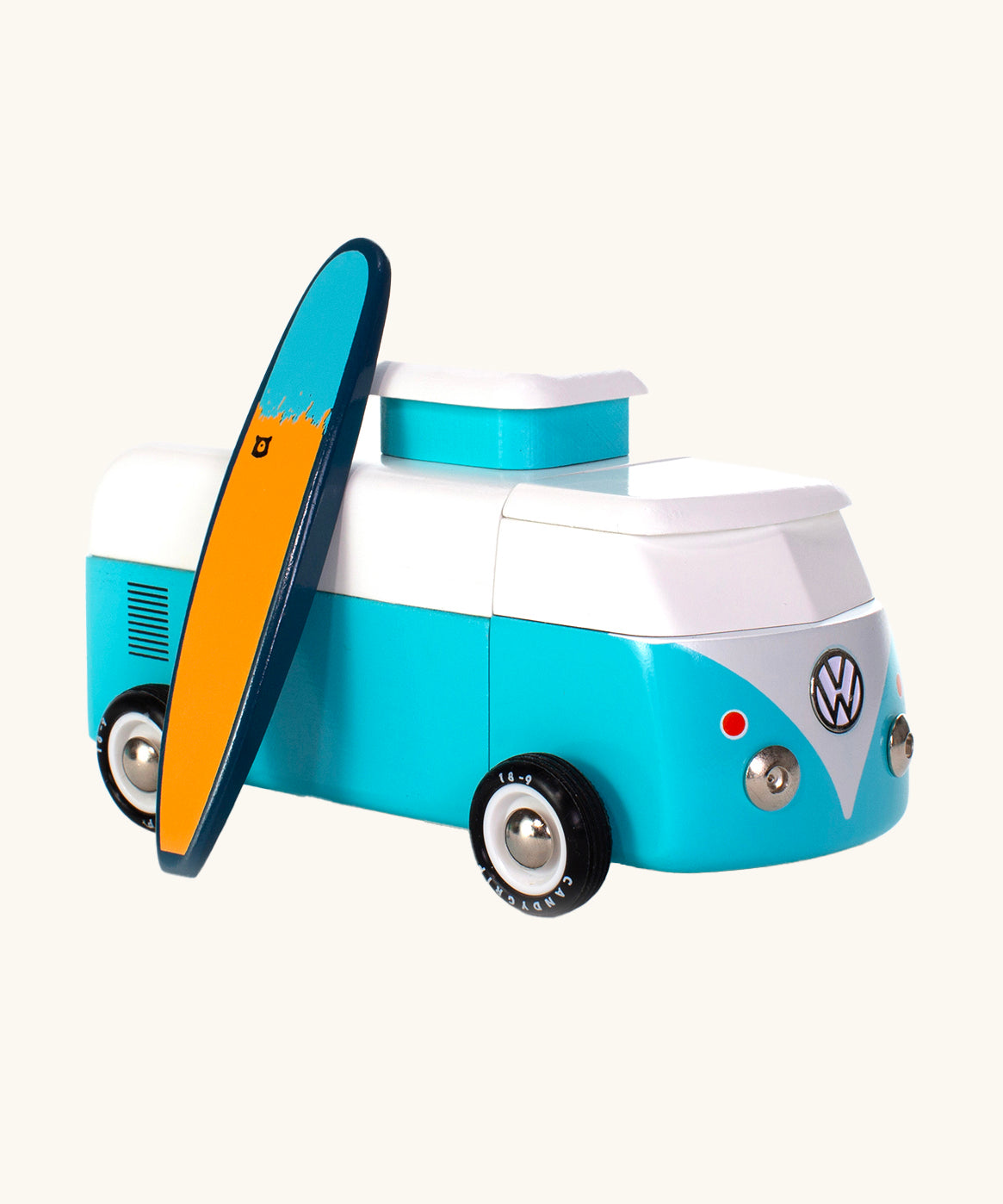 The Candylab VW Beach bus in blue, with a wooden blue and yellow surf board propped up next to the van, The image is on a cream background