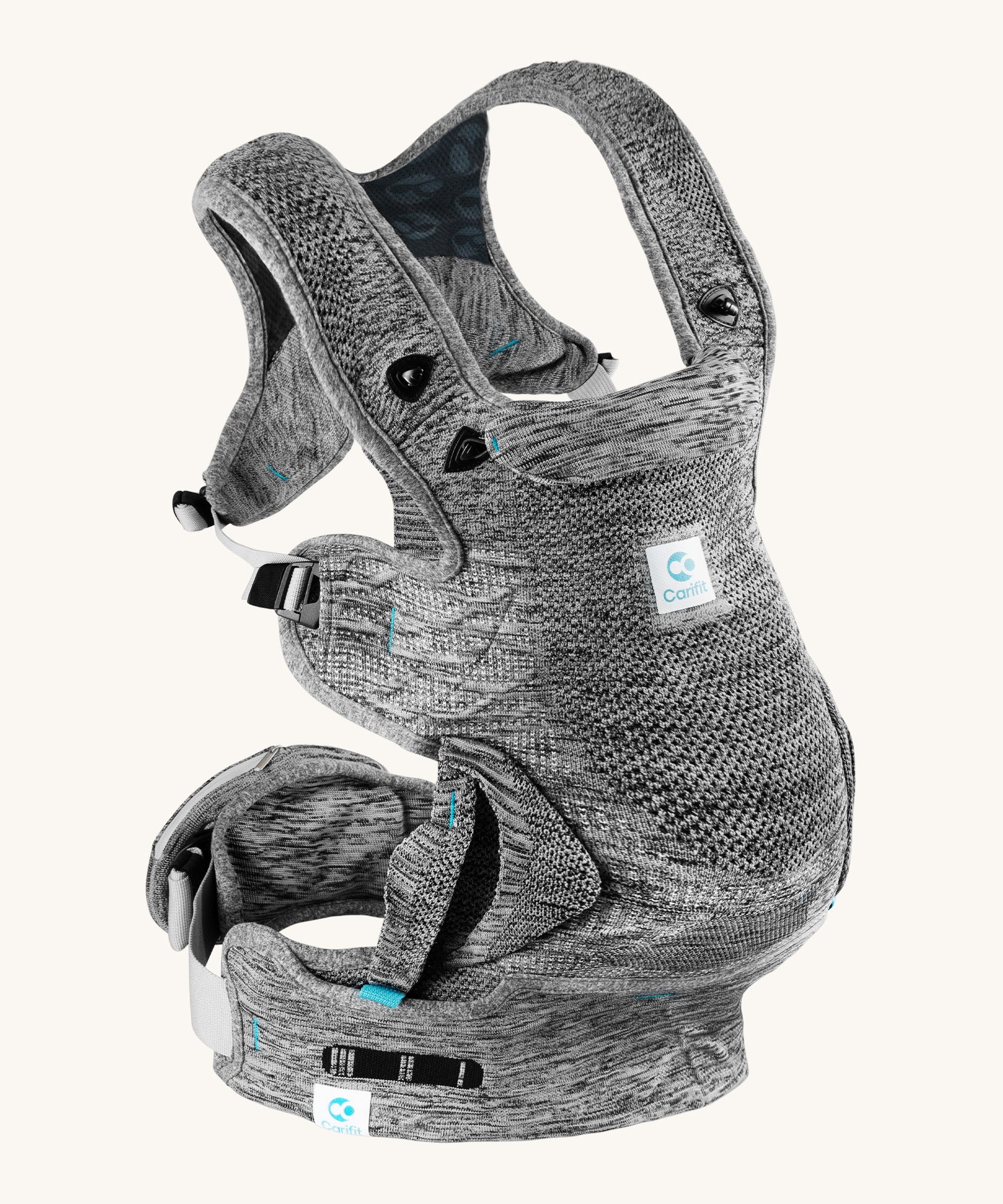 Carifit+ Fabric Baby Carrier in Grey, show from the side showing the adjustable straps, on a cream background