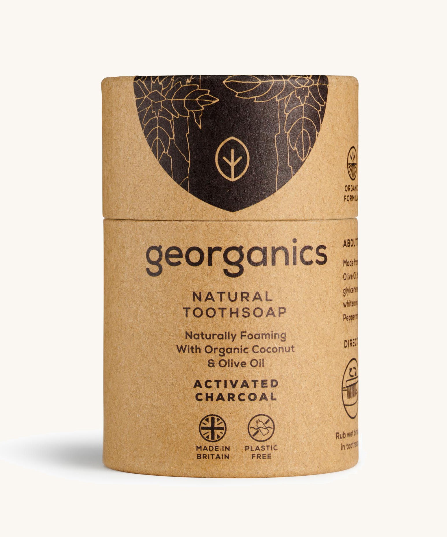 A Georganics charcoal toothsoap in cardboard packaging on a cream background