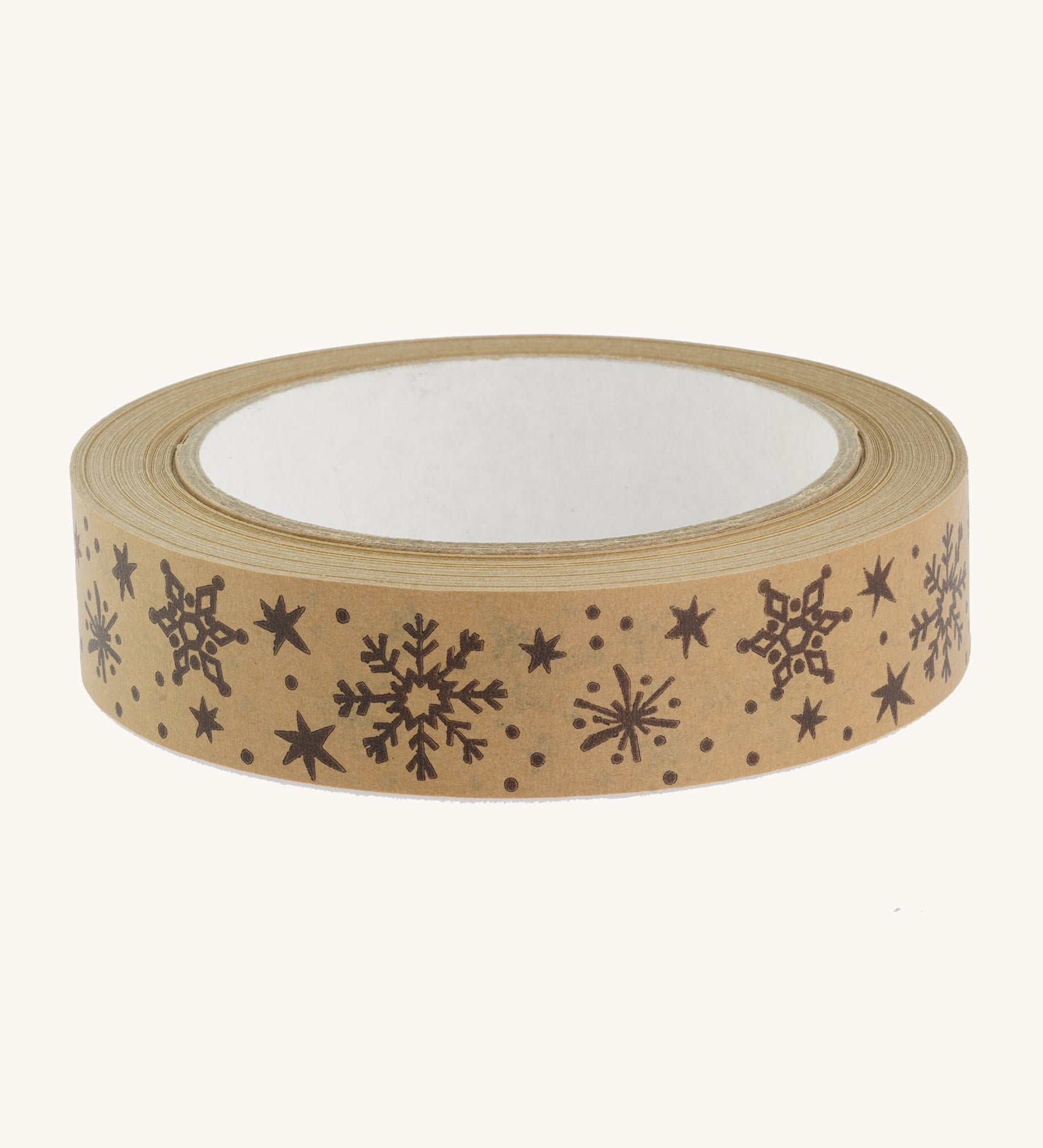 Christmas paper tape with brown snowflake design on cream background.