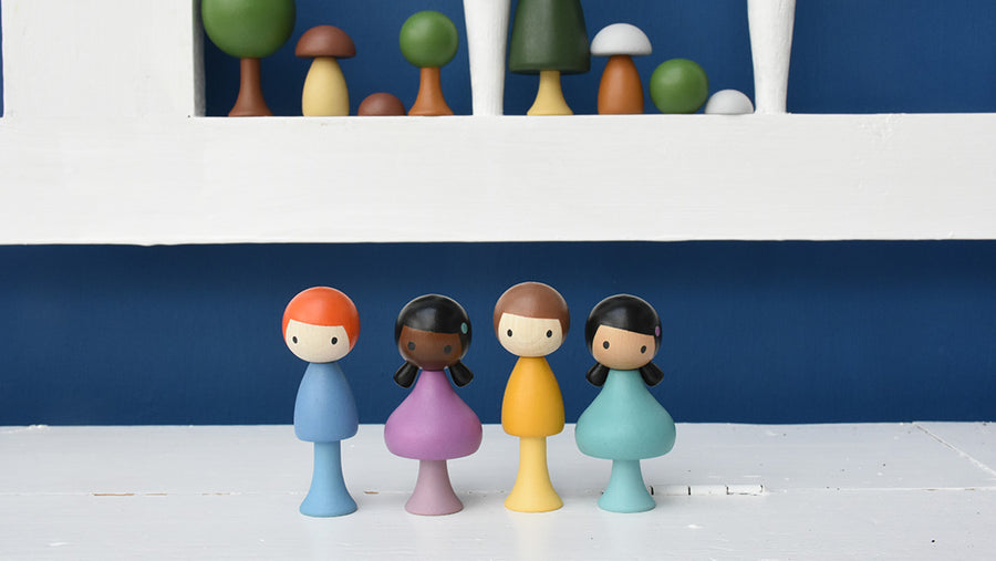 Four Clicques wooden peg dolls