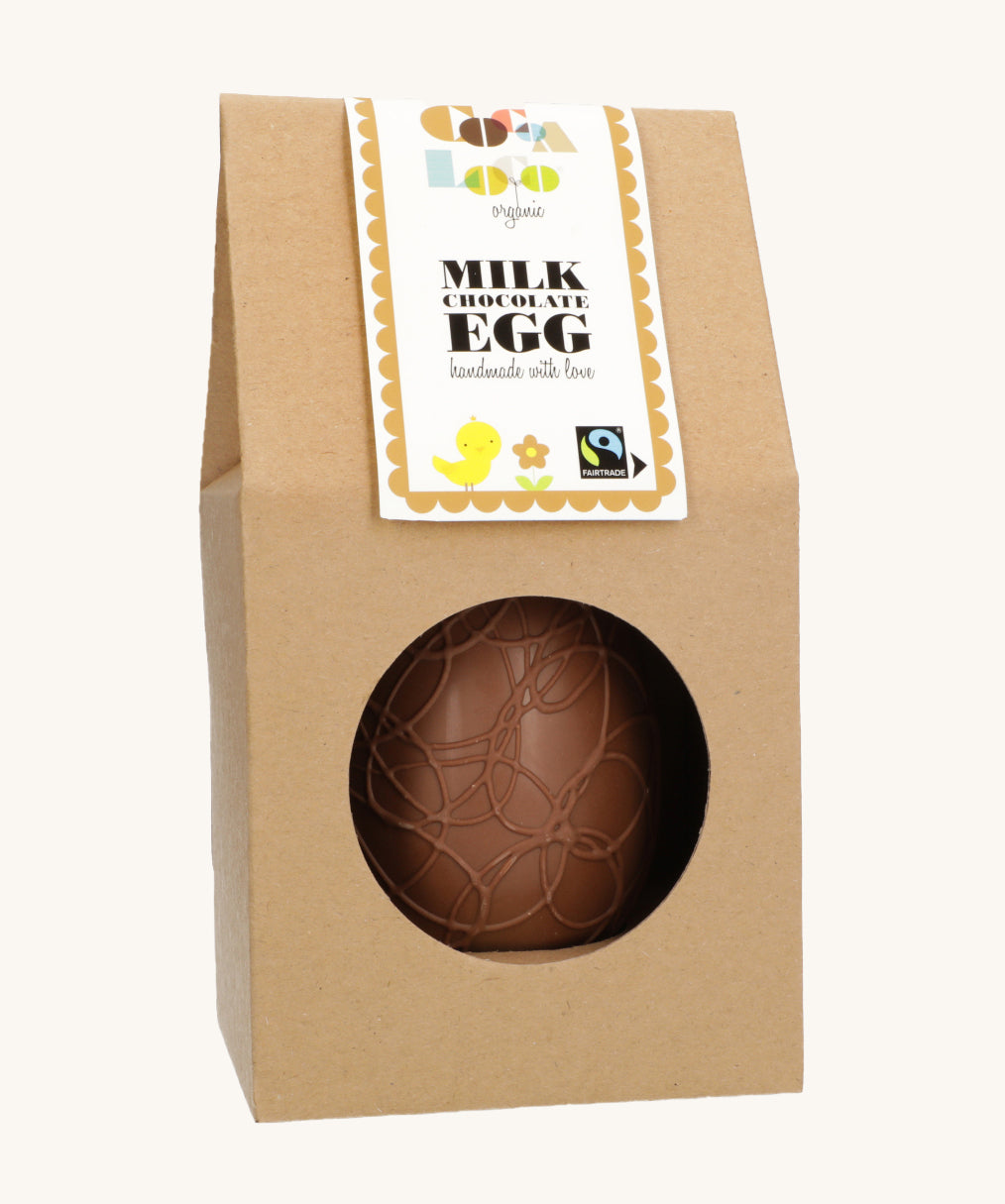 Cocoa Loco organic Fairtrade milk chocolate Easter egg, hand-decorated with delicate swirls. Presented in eco-friendly brown paper packaging with a clear window.