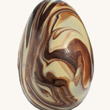 Cocoa Loco organic Fairtrade marbled Easter egg, a handmade blend of milk, dark, and white chocolate with a striking swirl effect.