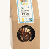 Cocoa Loco organic Fairtrade marbled Easter egg, handmade in the UK with swirls of milk, dark, and white chocolate. Presented in eco-friendly brown paper packaging.