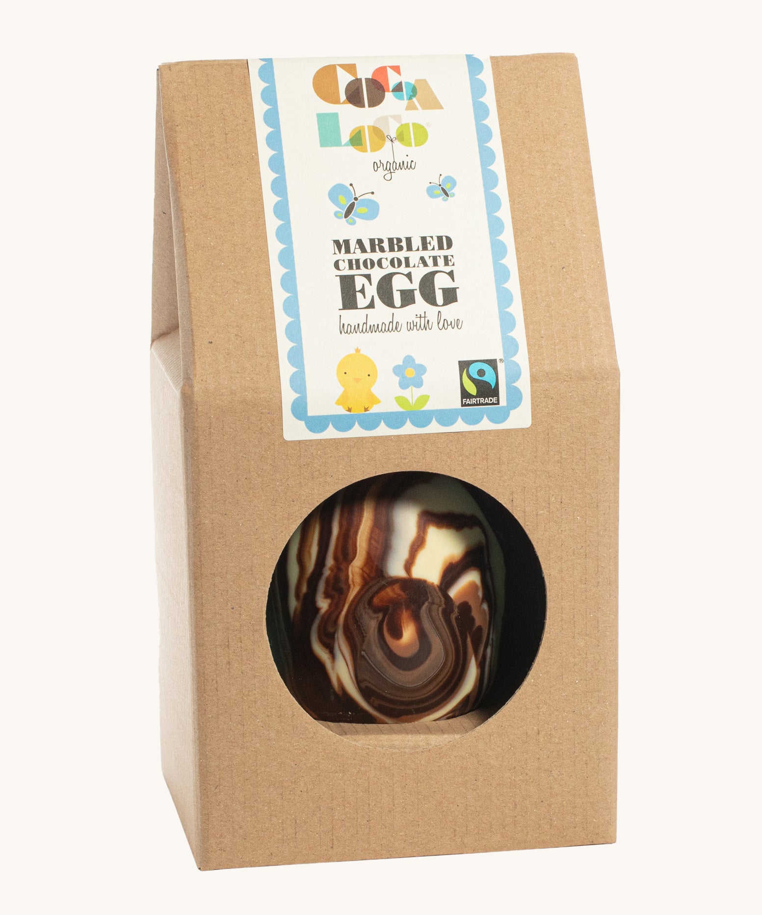 Cocoa Loco organic Fairtrade marbled Easter egg, handmade in the UK with swirls of milk, dark, and white chocolate. Presented in eco-friendly brown paper packaging.