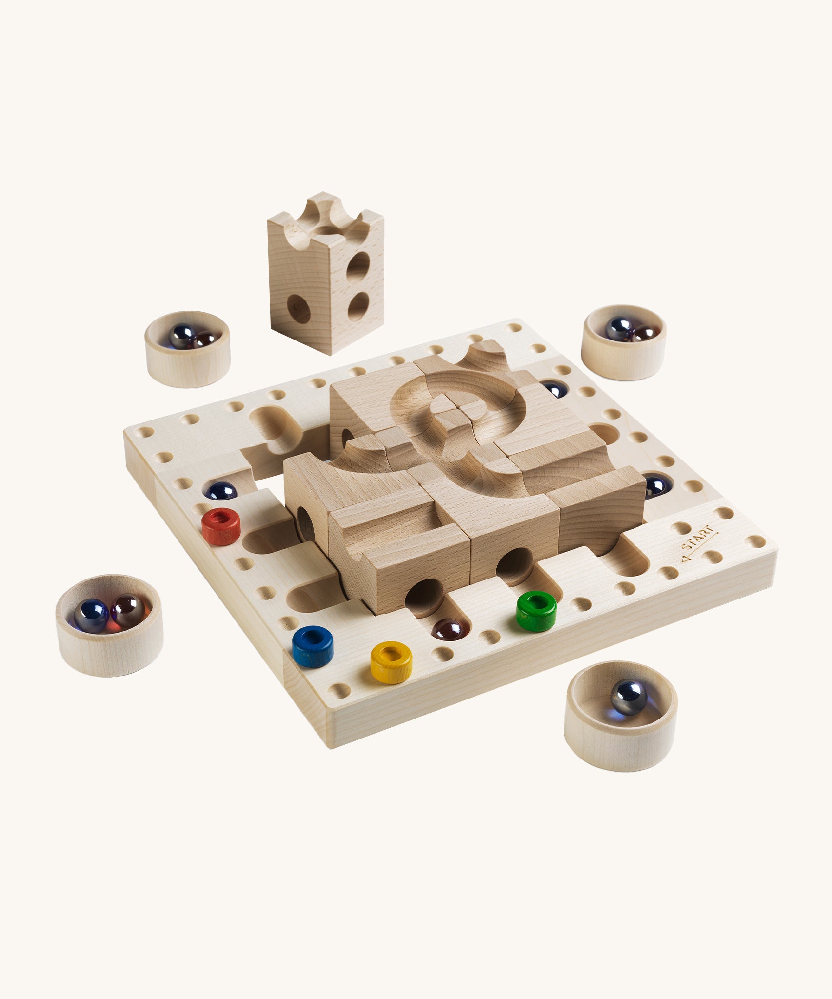 Cuboro Tricky Ways Board Game on a cream background. The image shows a wooden peg board with a marble run block section in the middle, 4 wooden small bowls each with some marbles inside.