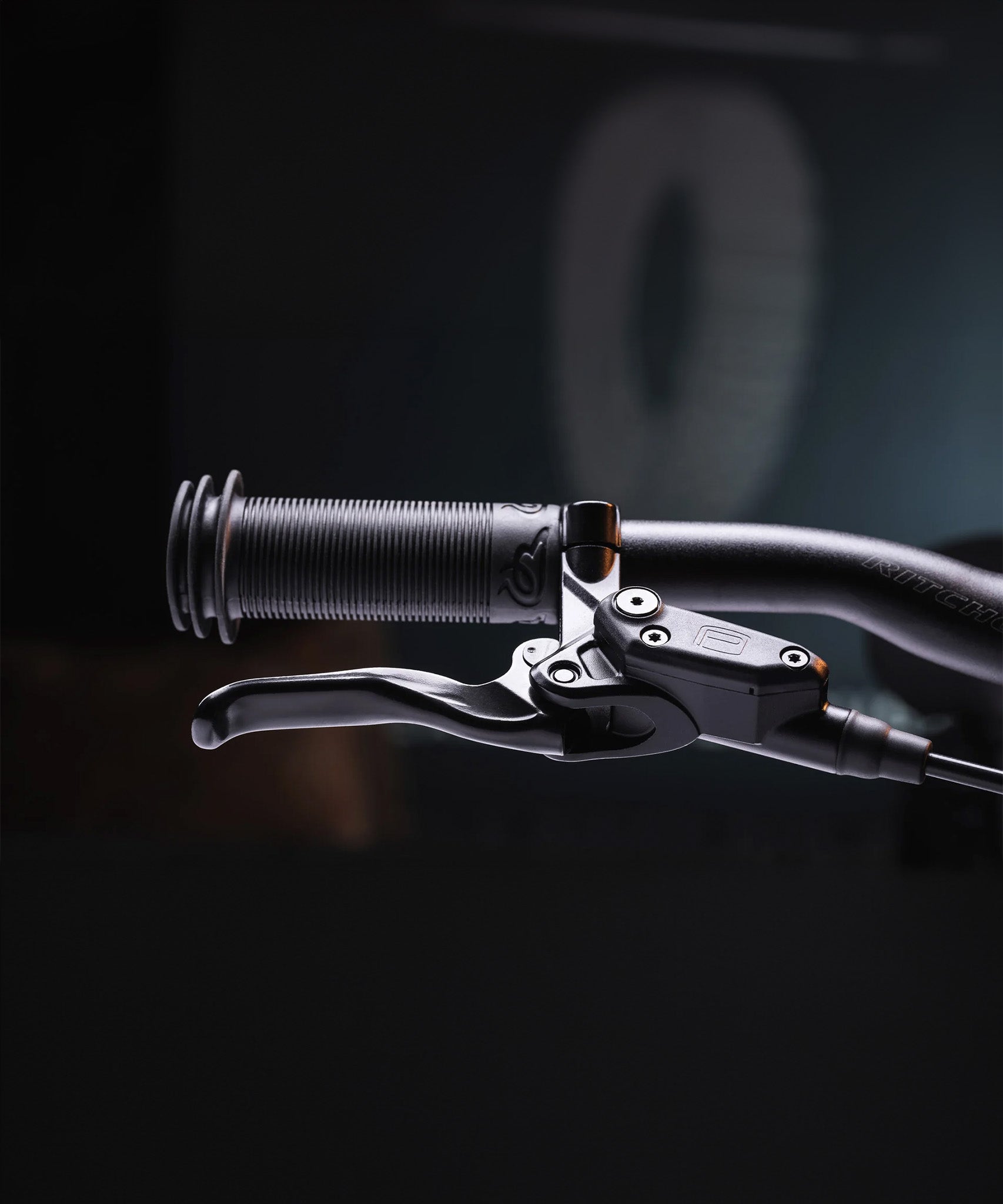 A closer look at the handle bar grips and break levers on the Early Rider Seeker X16 16" Bike - Brushed Aluminium