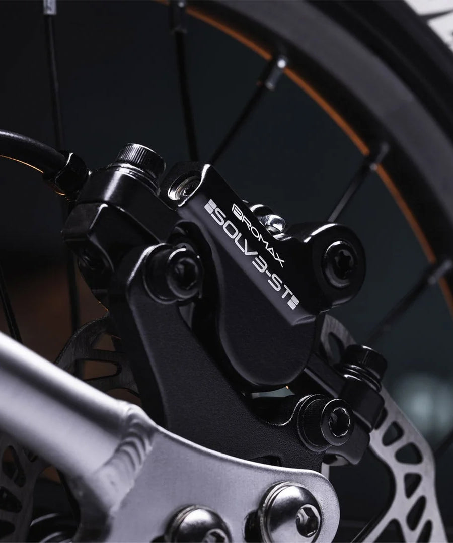 A closer look at the wheel of the Early Rider Seeker X16 16" Bike - Brushed Aluminium