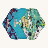 Three Earthwise reusable pads in blue underwater prints.