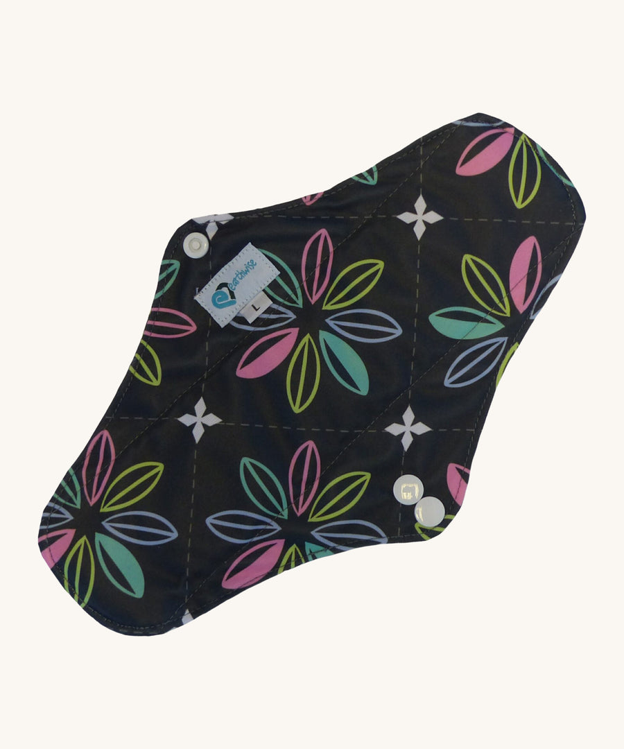 Earthwise reusable pad in charcoal with flowers print on black.