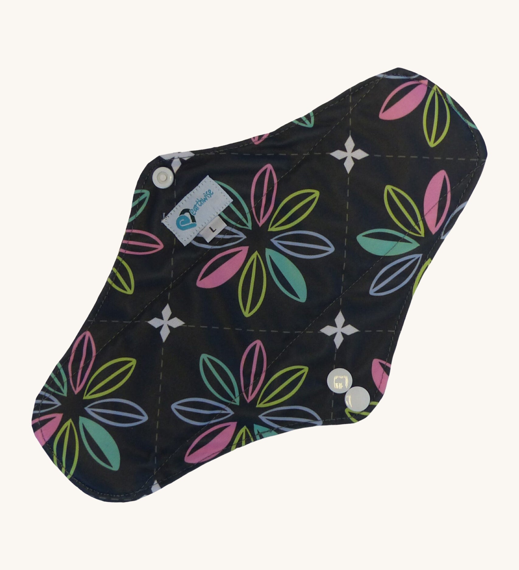 Earthwise reusable pad in charcoal with flowers print on black.