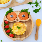 Eco Rascals Owl Bamboo Suction Plate with potatoe pie, peas and the owl eyes as orange segments, with and orange silicone and bamboo baby spoon.