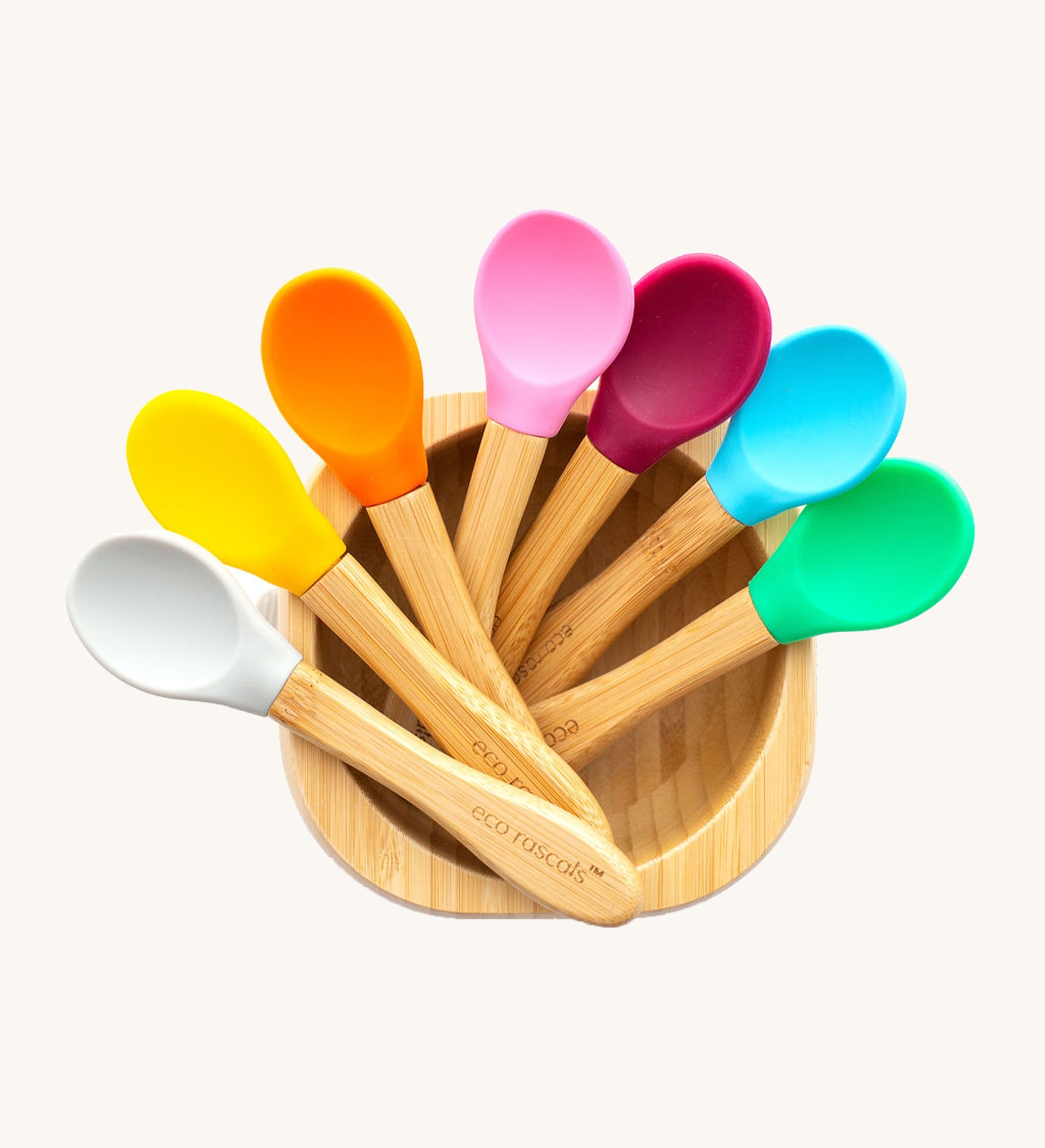 7 bamboo baby spoons with colourful silicone heads in a bamboo feeding bowl. 