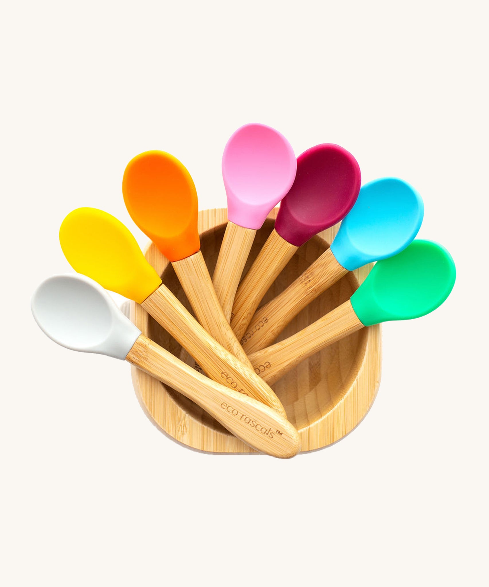 7 bamboo baby spoons with colourful silicone heads in a bamboo feeding bowl. 