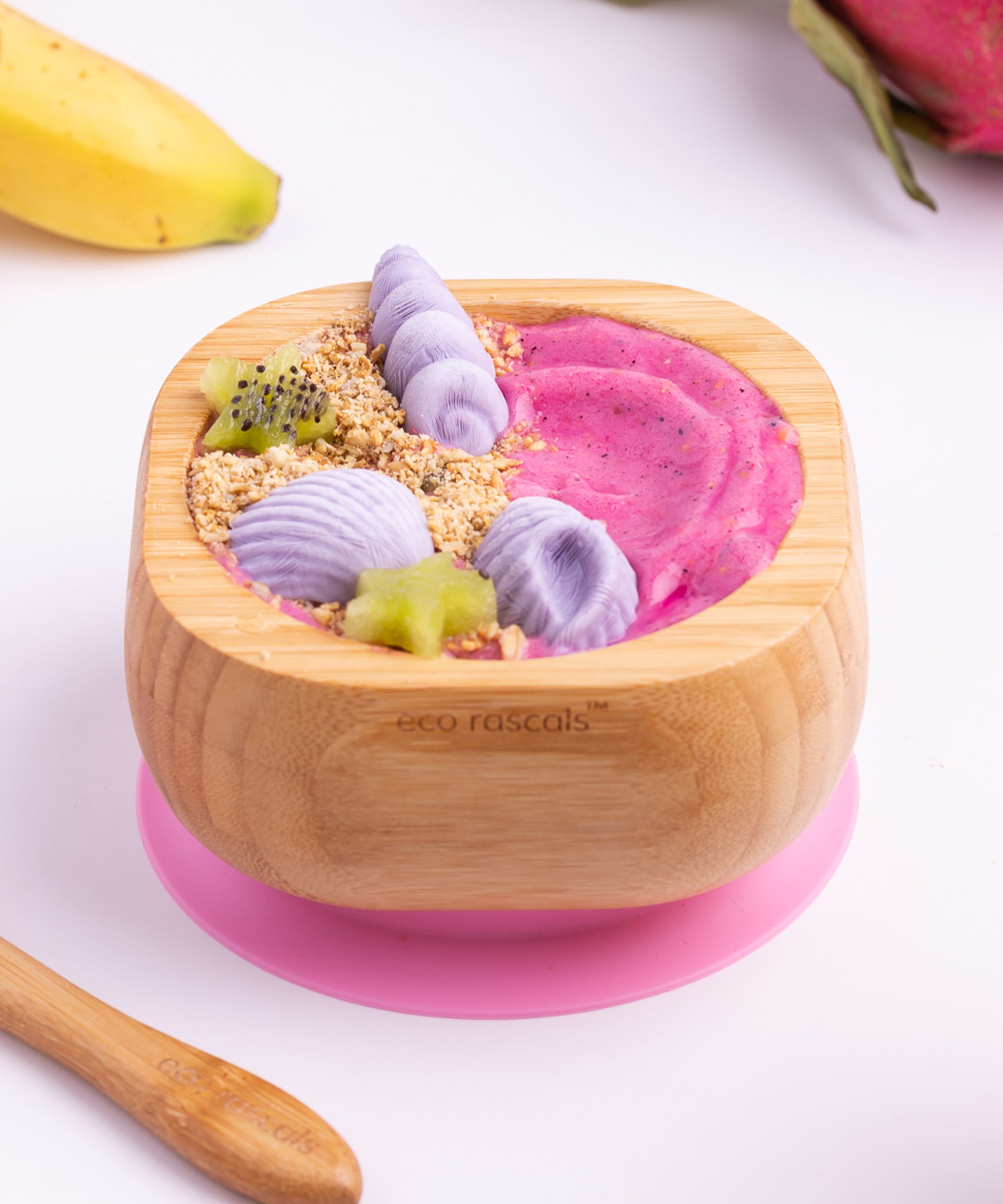 A pink and purple desert with fresh fruit in the Eco Rascals Bamboo Bowl & Spoon Weaning Set in pink silicone.