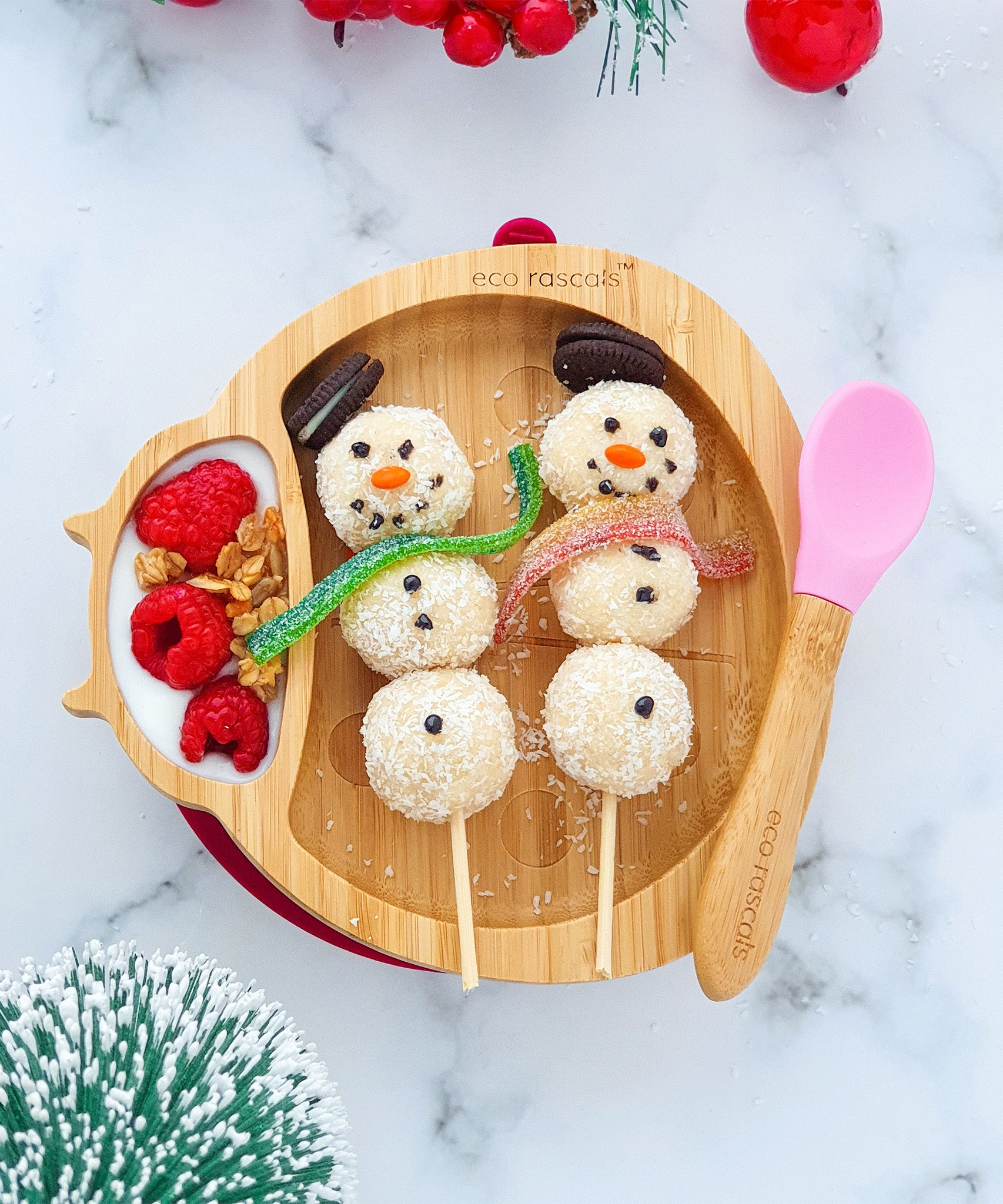 Eco Rascals Ladybird Bamboo Suction Plate with yogurt and berries and snowman kabab treats with a pink silicone and bamboo baby spoon. 