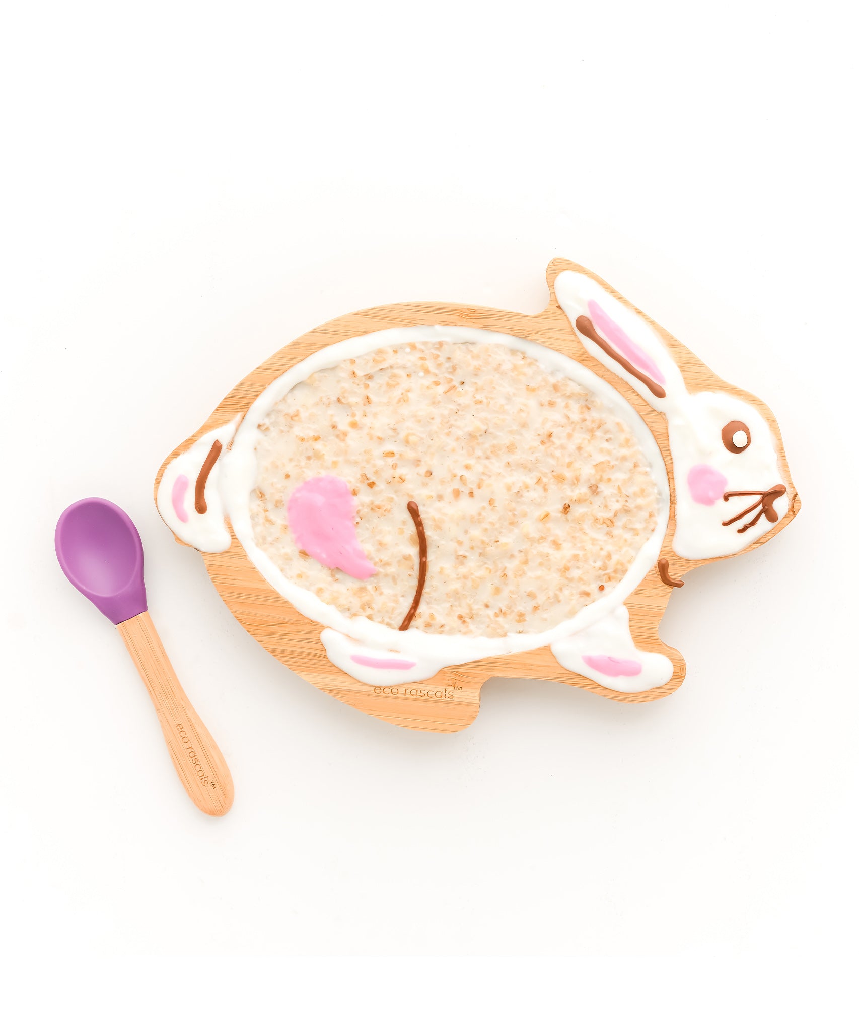 Bamboo rabbit kids plate with porridge and a bamboo and purple silicone baby spoon. 