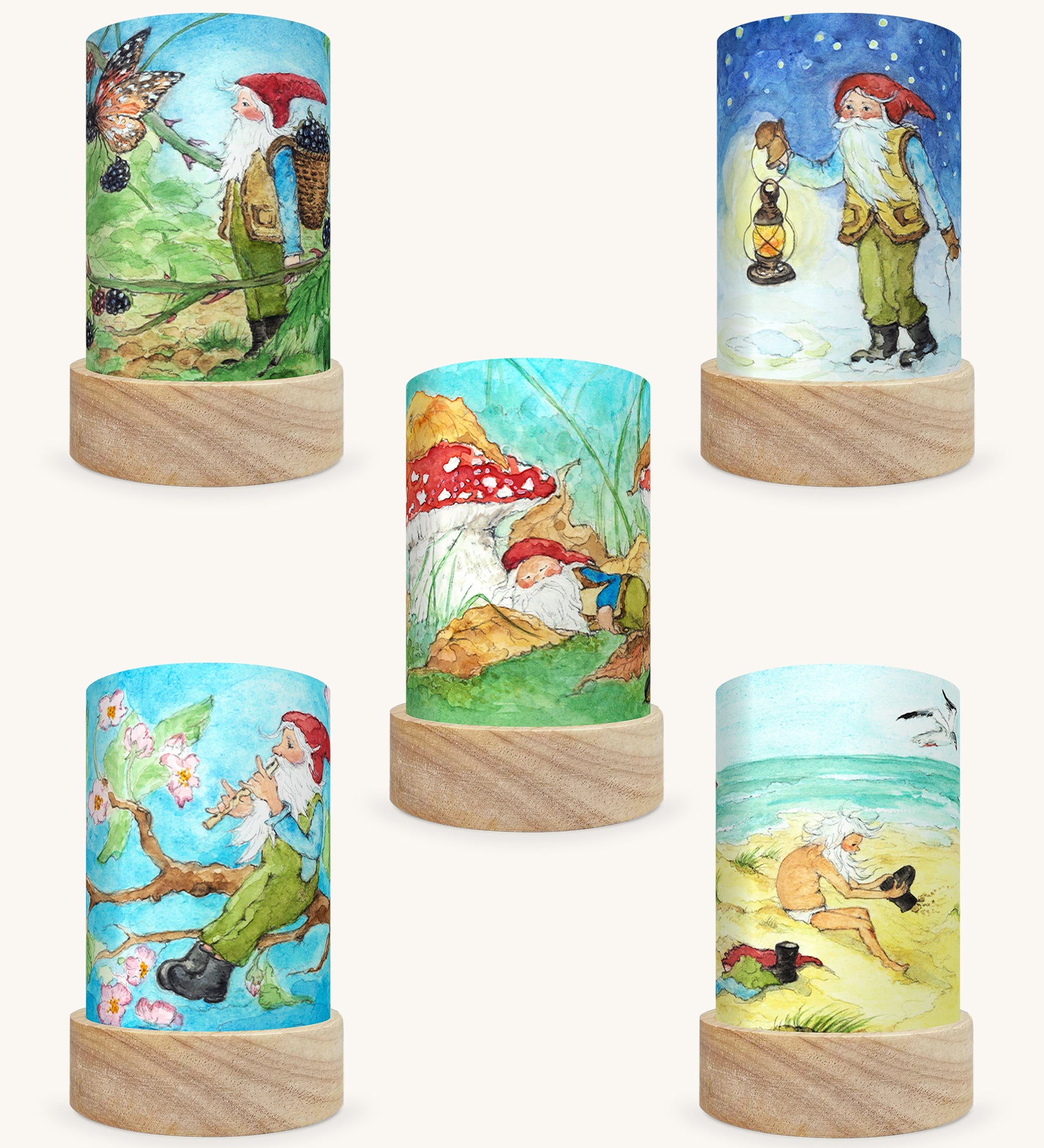 The George The Gnome Illustration Set by Eentje Van Margo, featuring 5 different Toverlux Magic Lantern Silhouettes which are: Gnome Spring, Gnome Summer, Gnome Sea, Gnome Autumn, Gnome Winter. The image is on a cream background.