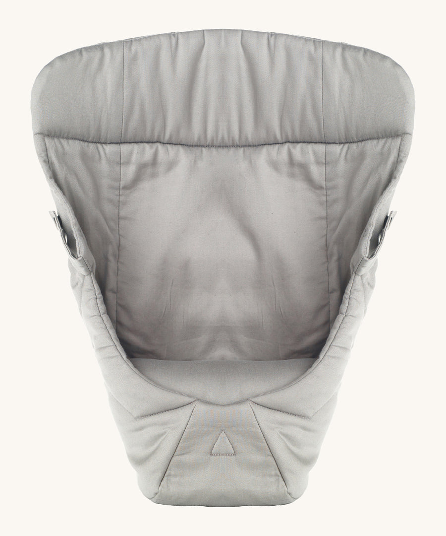 Ergobaby Baby Carrier insert in Grey, on a cream background. The image shows the Carrier Insert from the front with the seat cushion inside the insert