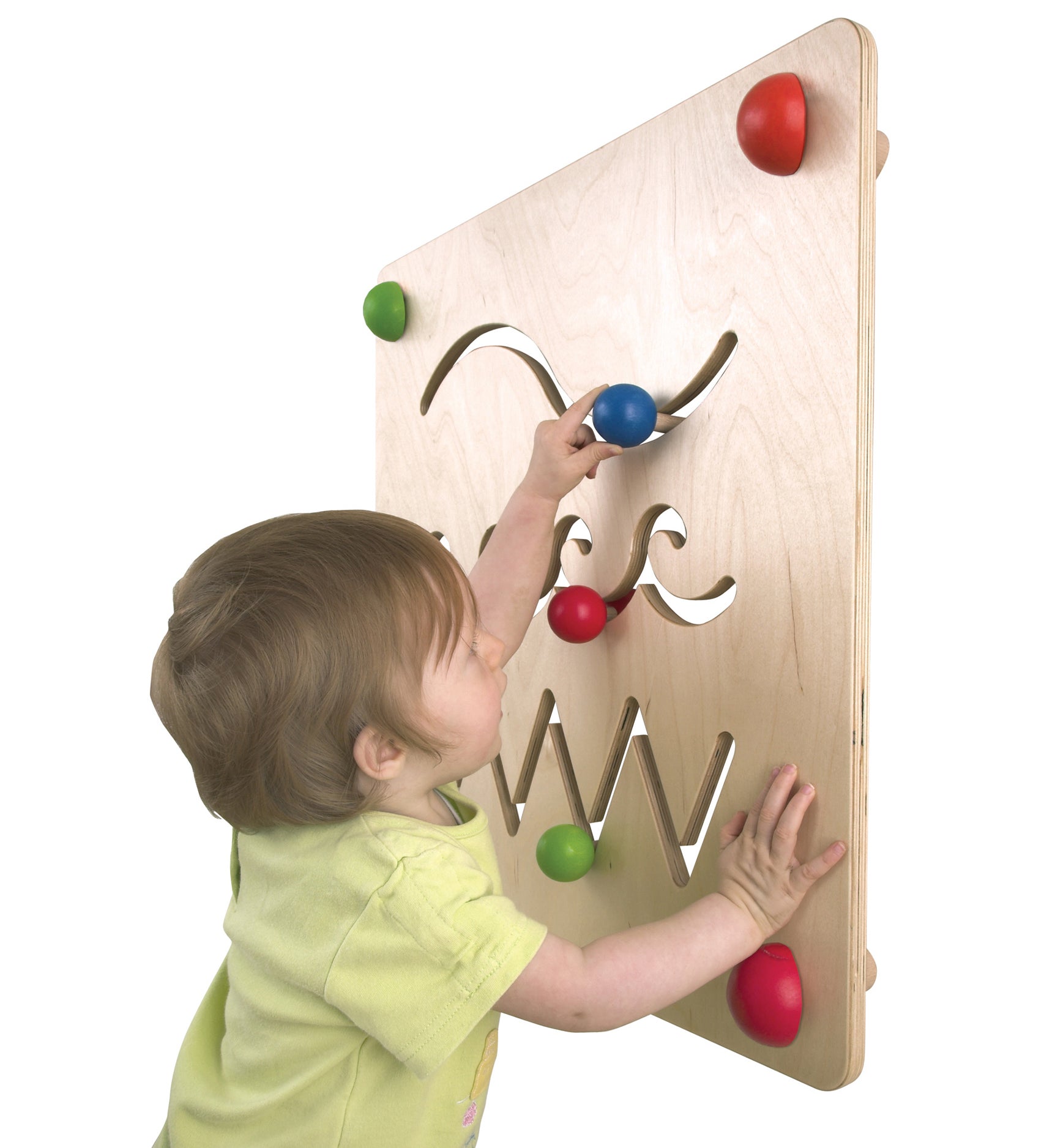 A child concentrating and moving the wooden part along the wavy maze path