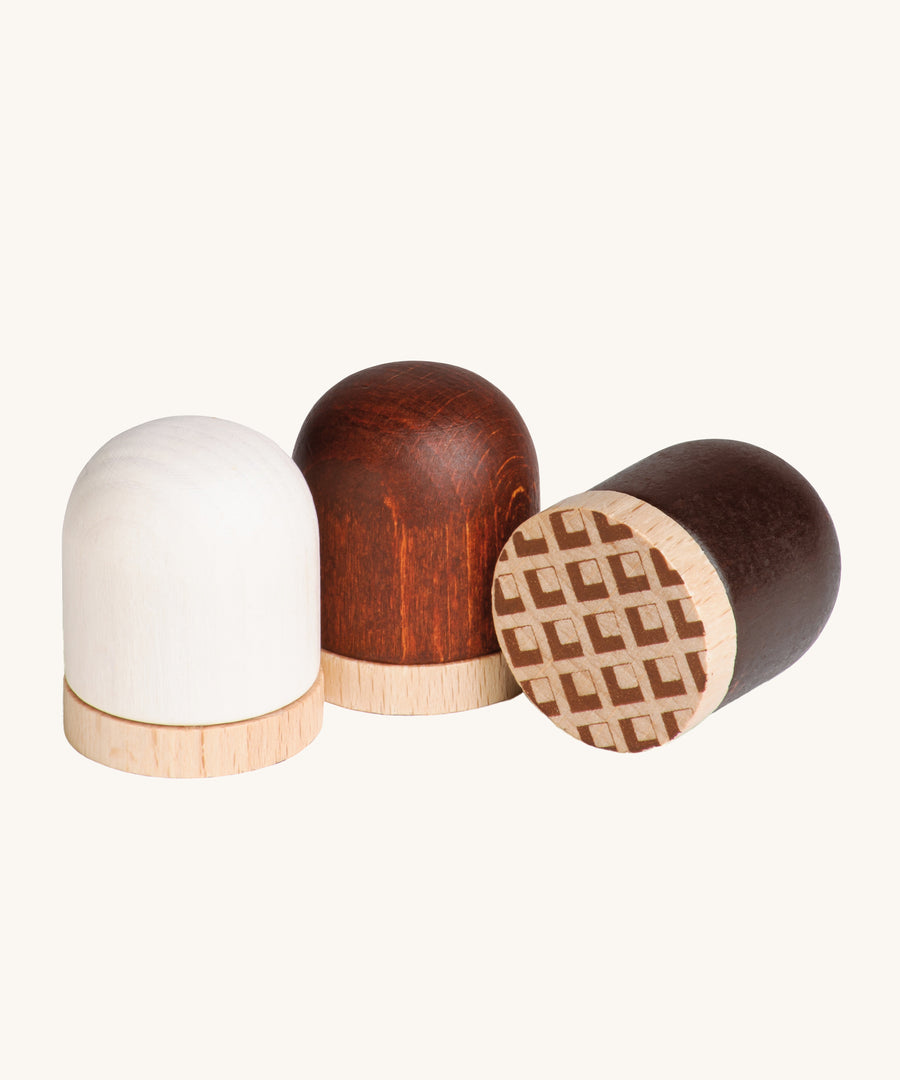 A closer look at the Erzi Toys marshmallows, showing the natural wood grain through the paint work.