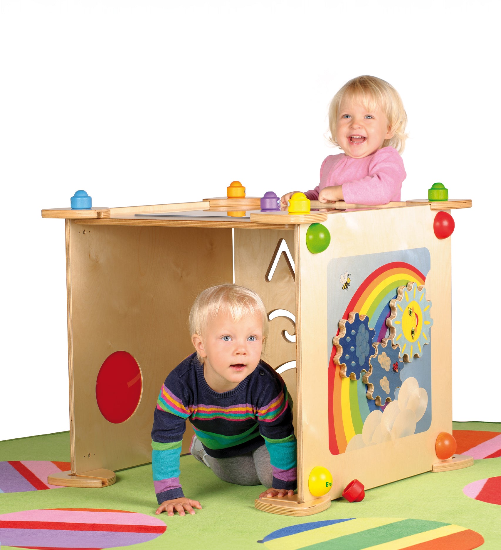 Children happily playing with the Erzi wall boards which are connected together to create a sensory and learning den