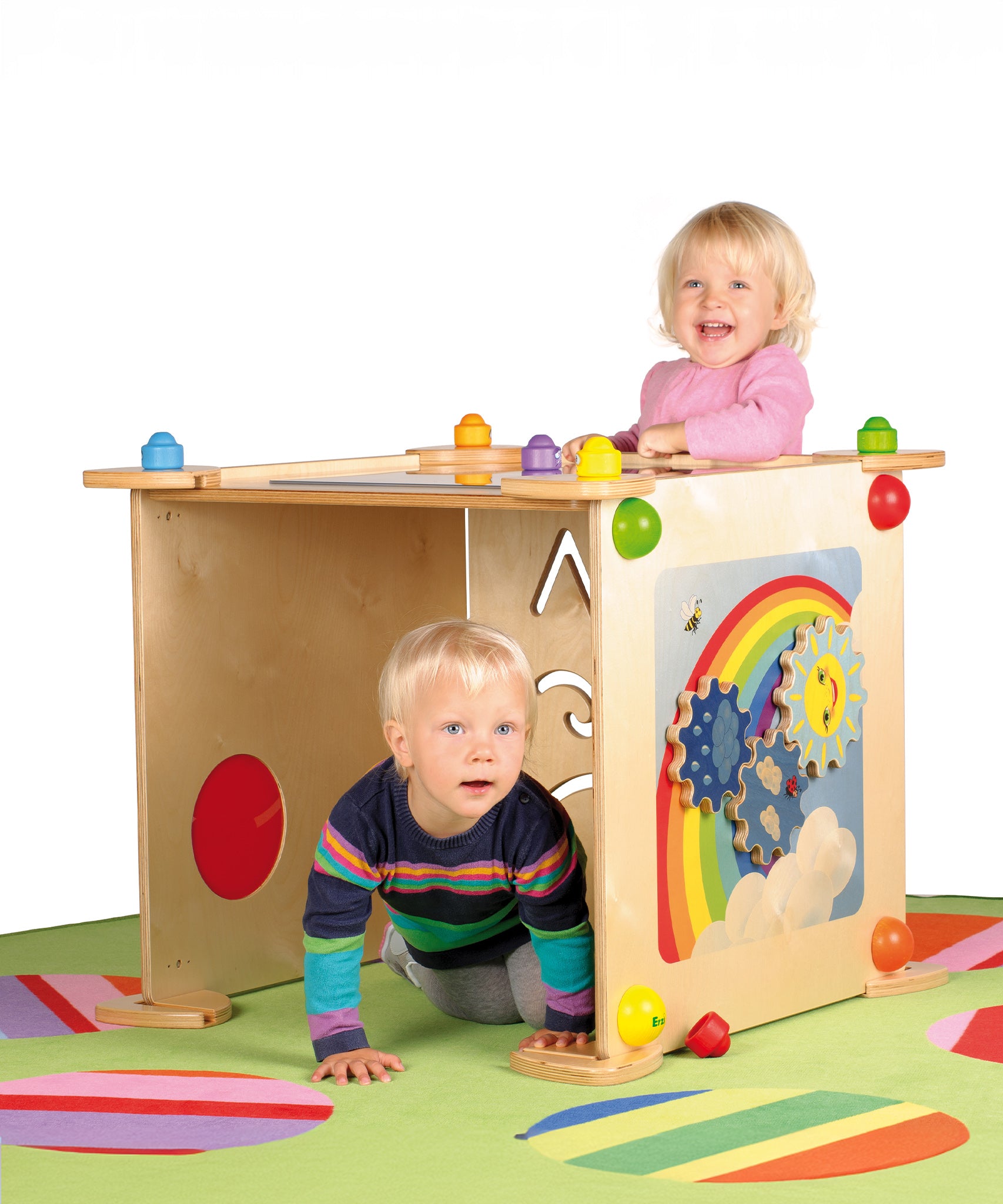 Children happily playing with the Erzi wall boards which are connected together to create a sensory and learning den