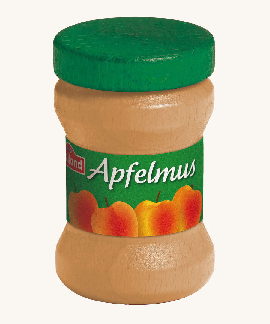 Erzi Wooden Apple Sauce jar, with a green lid and apple label. On a cream background. Perfect for playing cafe or shop