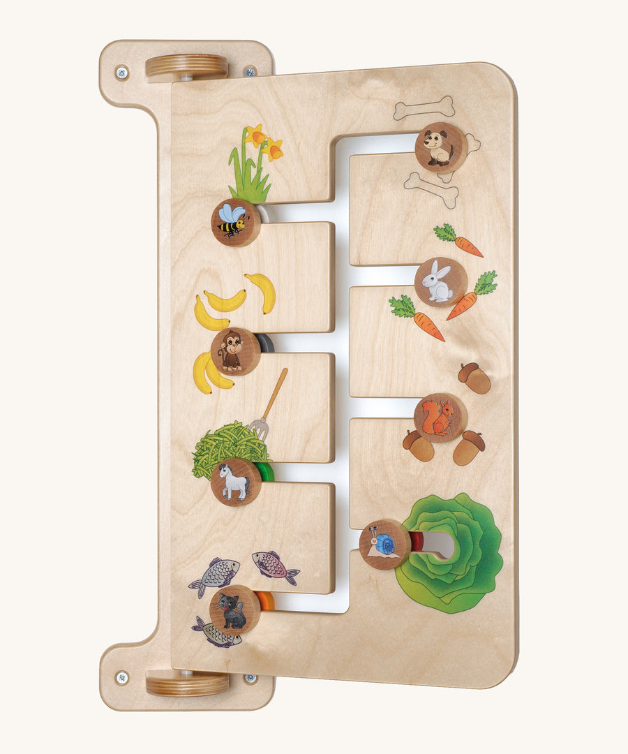 A closer look at one side of the Erzi Baby Animal Wallboard Game, showing an animal and their food matching game